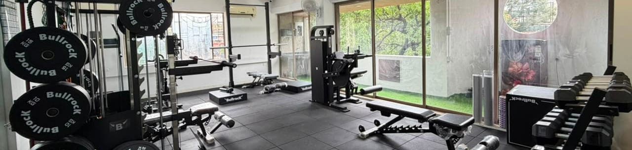 The training studio floor, looking across the racks towards the windows