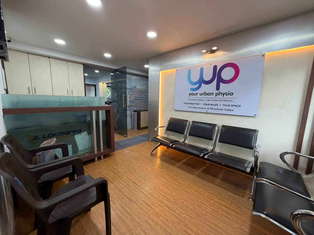 The reception and waiting area, with the Your Urban Physio sign above the seating